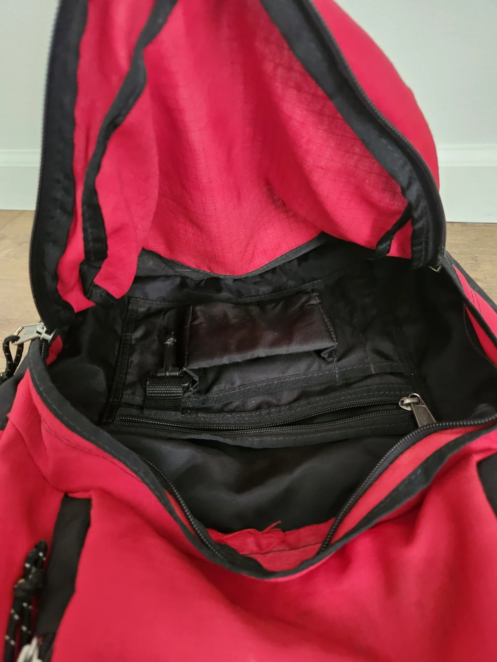 Eastpak Red and Black Backpack with Multiple Compartments